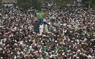 Pakistani supporters of convicted murderer Mumtaz Qadri offers funeral prayers for Qadri a day after his execution in Rawalpindi on March 1, 2016. Tens of thousands of supporters of a Pakistani Islamist executed for gunning down a liberal governor gathered for his funeral March 1, sparking fears of violence, as schools closed and police cordoned off flashpoints. AFP PHOTO / Aamir QURESHI / AFP / AAMIR QURESHI (Photo credit: AAMIR QURESHI/AFP/Getty Images)